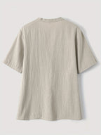 Elegante Bluse mit V-Ausschnitt und Holzknöpfen