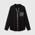 Blusa Negra con Detalles Brillantes de Corte Fluido