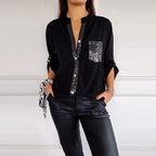Blusa Negra con Detalles Brillantes de Corte Fluido